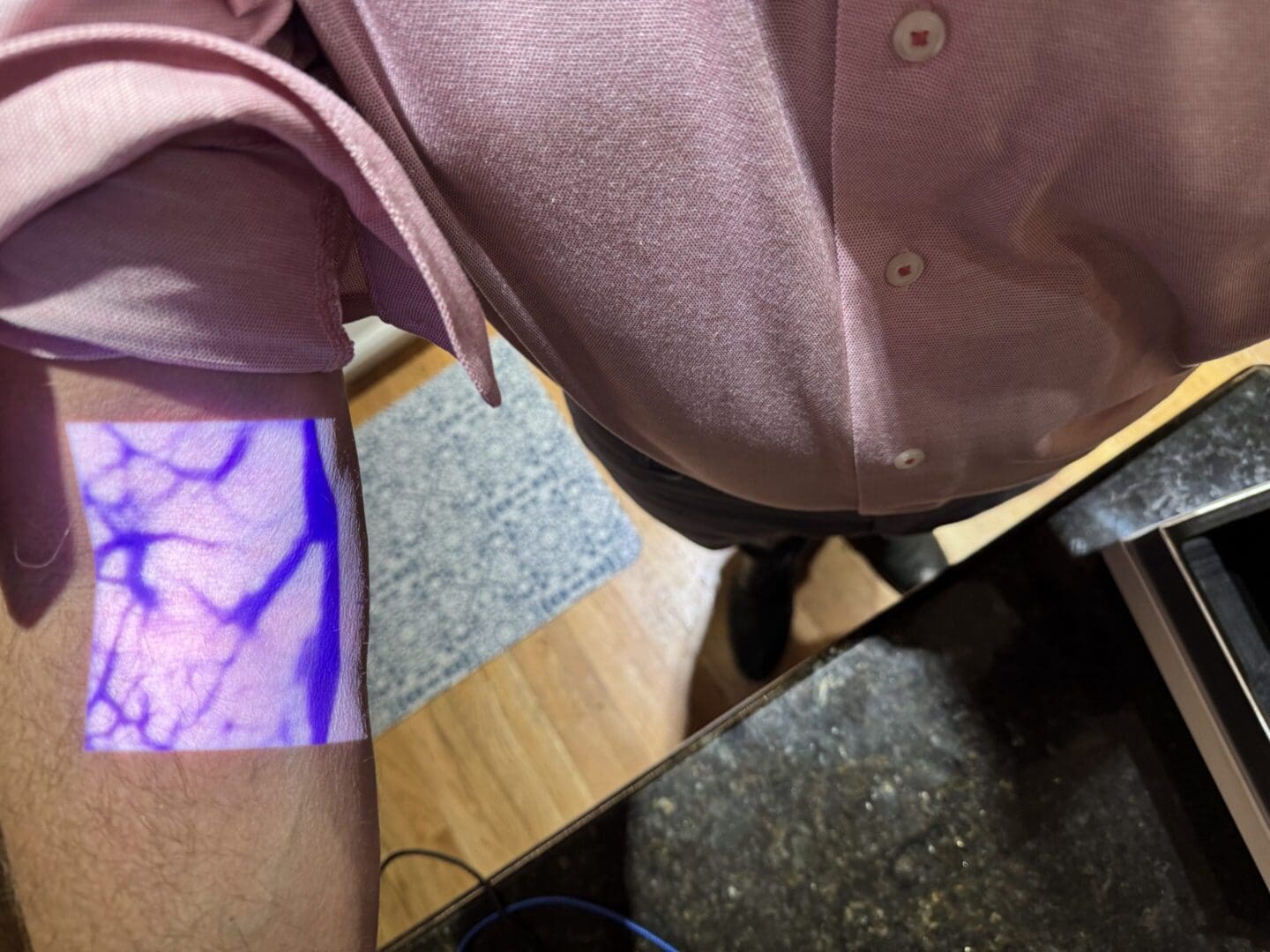 Blue light revealing veins on forearm